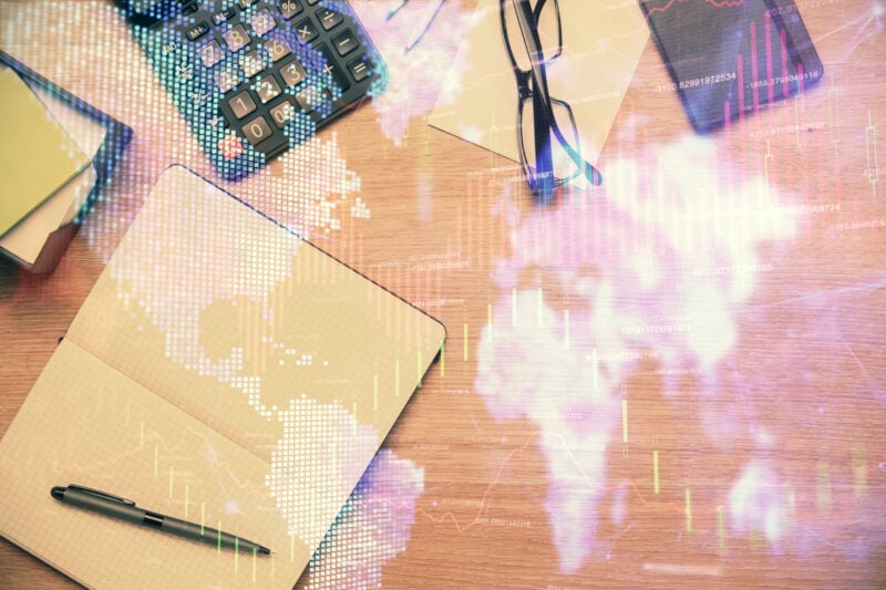 Double exposure of forex graph drawing and work table top veiw. Concept of financial analysis.