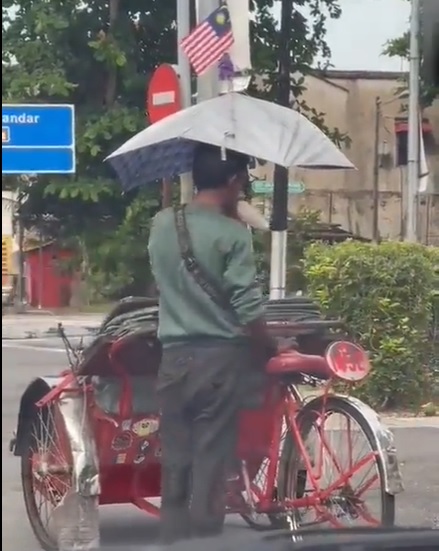 三轮车夫疑当街吸强力胶 网民：会把人载去月球