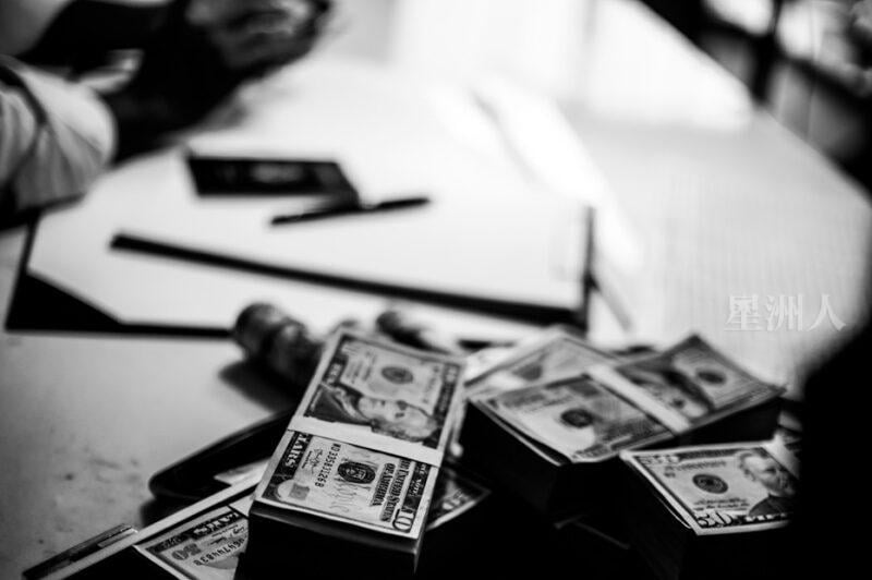 Pile Of Banknotes And Documents On A Table. Black And White Tone