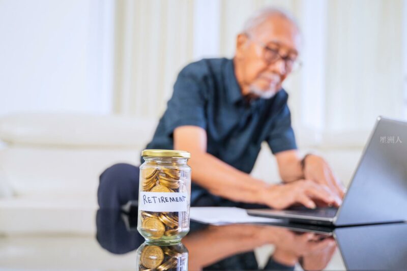 Golden Coins In A Jar With Retirement Word