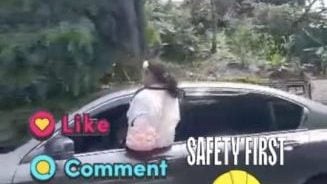 坐行驶中轿车车窗上   警方捕女童母亲查办