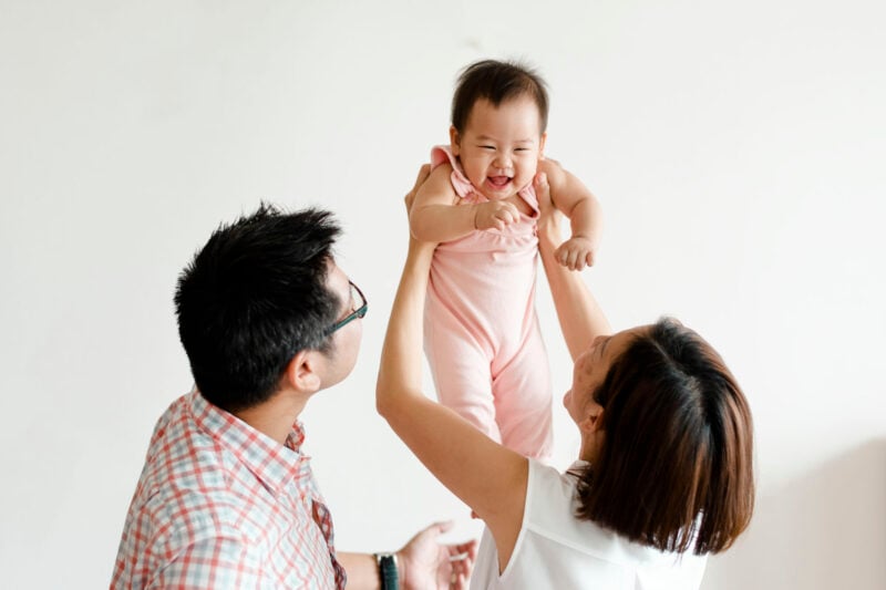 Parents Playing With Their Baby