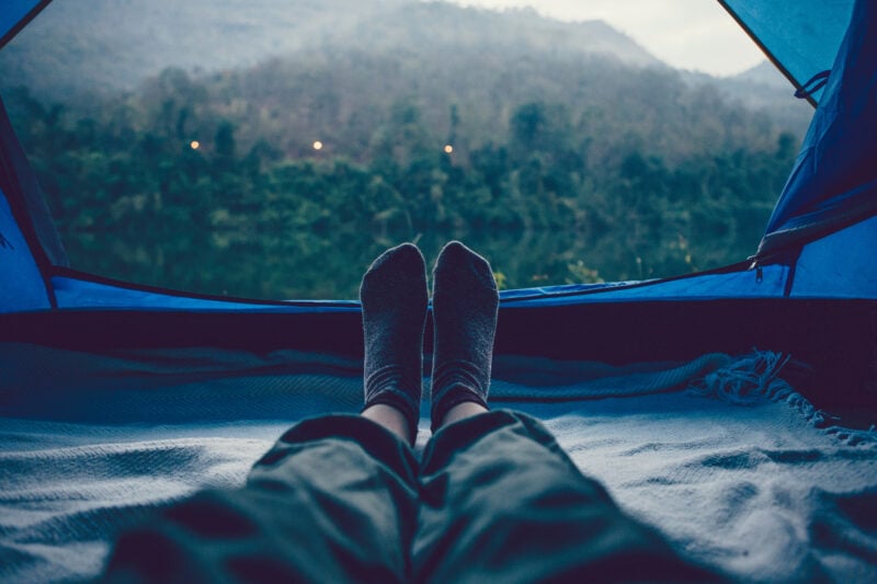 Woman Sleeping In A Tent With An Amazing View