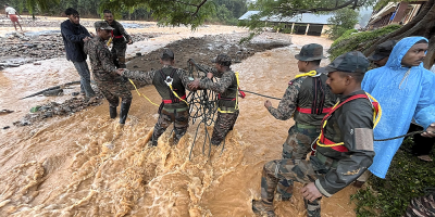 Rescuers search through mud and debris as deaths rise to 151 in landslides in southern India