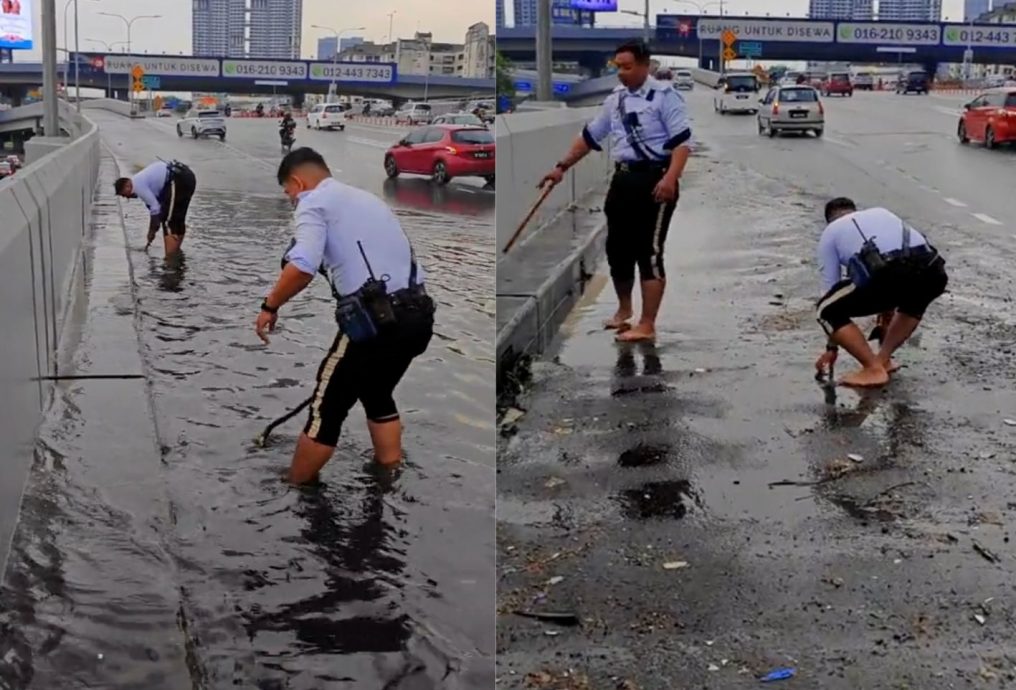 徒手清理堵塞水沟赢赞赏 交警：“非职责范但愿意服务民众”