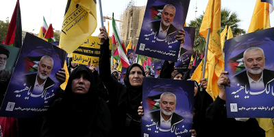 Iran’s supreme leader prays over the coffin of Hamas leader Haniyeh, whose killing risks a wider war