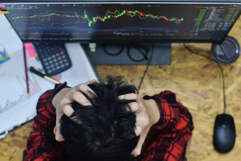 Fatigue Man Hands Holding The Head Because Of Stress And Having A Headache At Home Office In While Trading Forex Or Stocks Market Online Investment At Night Time