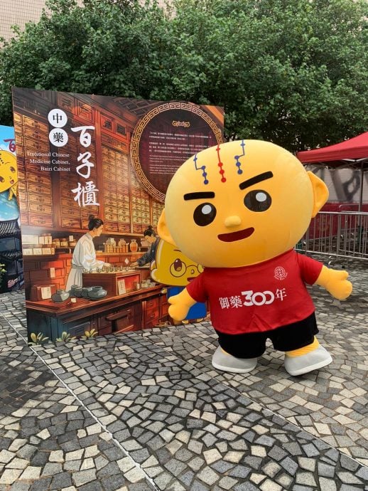 Bronze boy, ambassador for Hong Kong Beijing Tong Ren Tang, showcasing Traditional Chinese Medicine culture.