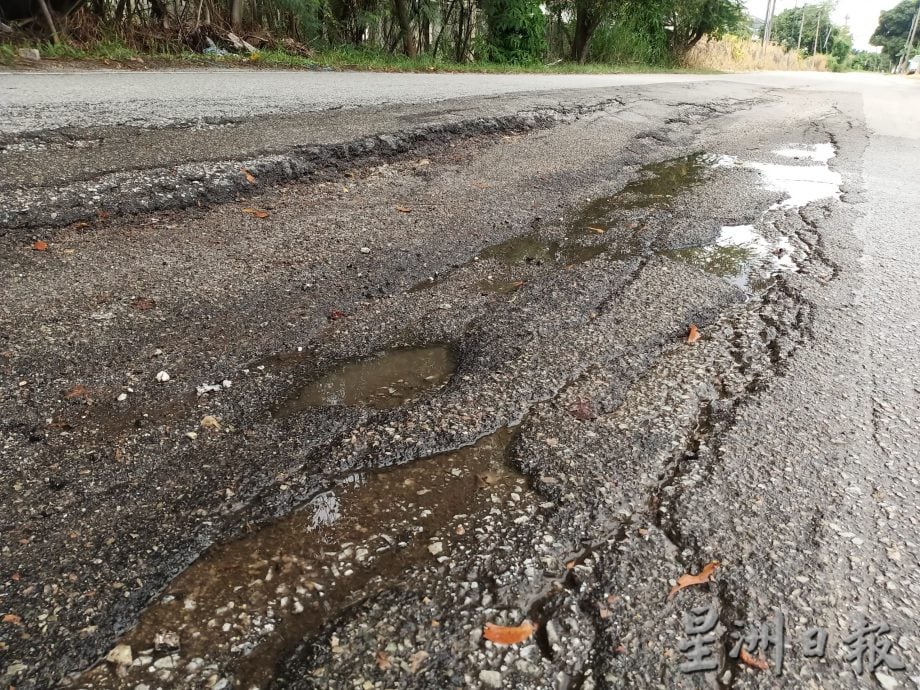 大都会/黄智荣建议设限高杆解决道路损坏