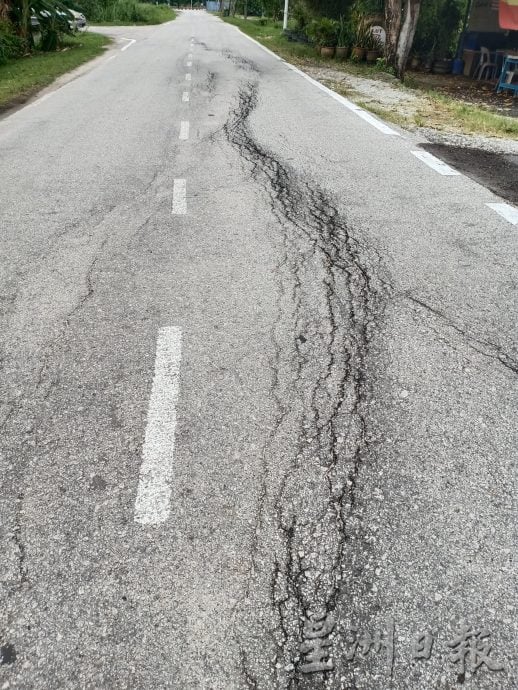 大都会/黄智荣建议设限高杆解决道路损坏