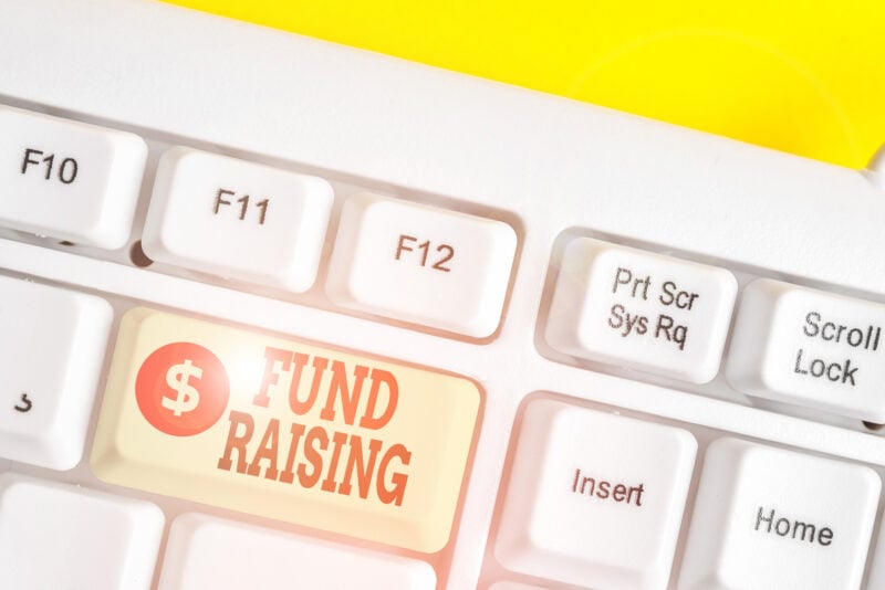 Text Sign Showing Fund Raising. Conceptual Photo The Act Of Seeking To Generate Financial Support For A Charity White Pc Keyboard With Empty Note Paper Above White Background Key Copy Space.