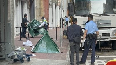 女子堕楼亡  男途人遭砸中危殆