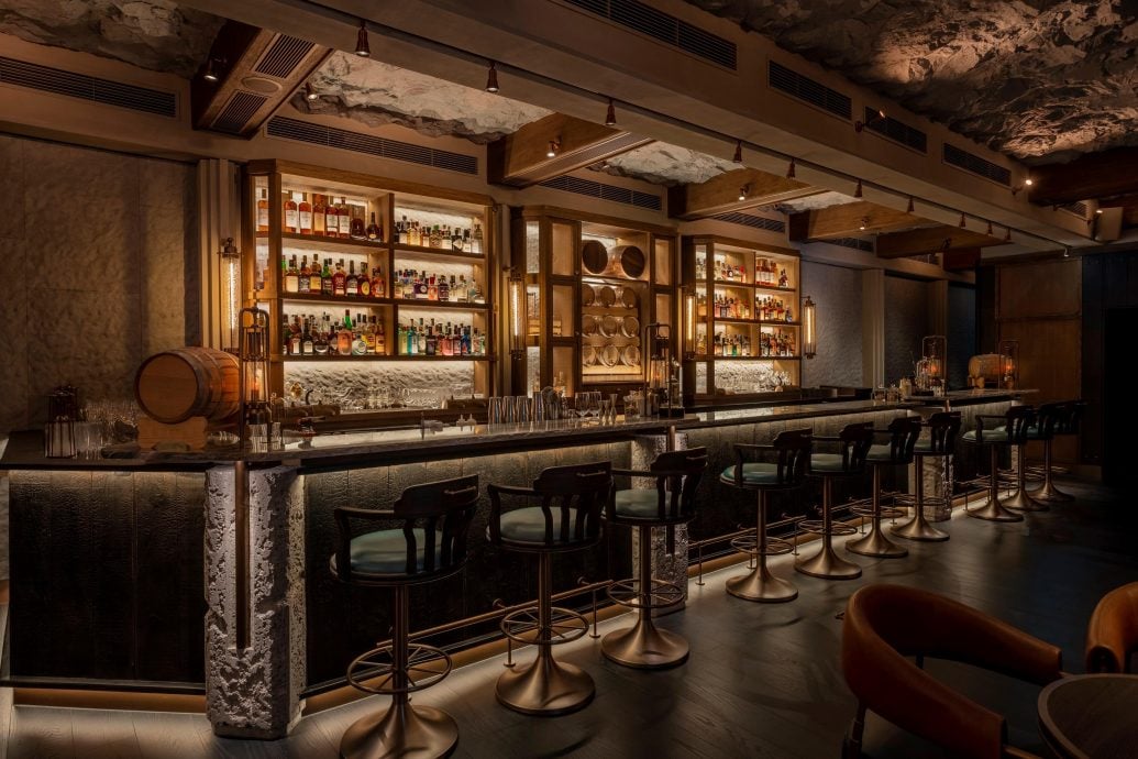 The interior design of Long Bar is inspired by the coastal caves of Macau where the gin was distilled and stored, as well as the voyages of the legendary Portuguese merchant ship Madre de Deus and has been honored with the 